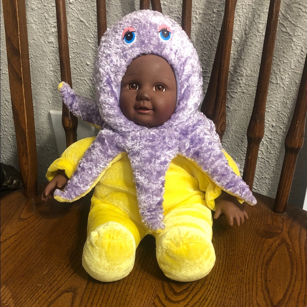 Plush Baby Doll in Yellow Outfit with Purple Octopus Hat